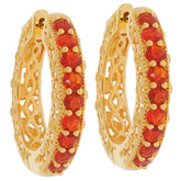 Elegant gold hoop earrings featuring vibrant orange gemstones, perfect for adding a touch of luxury to any outfit.